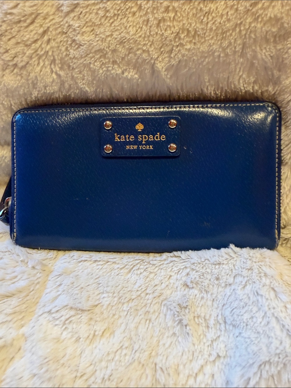 kate spade New York cobalt blue leather zip-around wallet